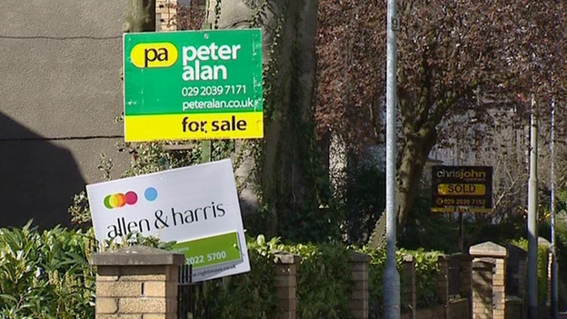 Estate agent boards outside houses in Cardiff