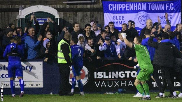 Chippenham players celebrate beating Lincoln in the FA Cup