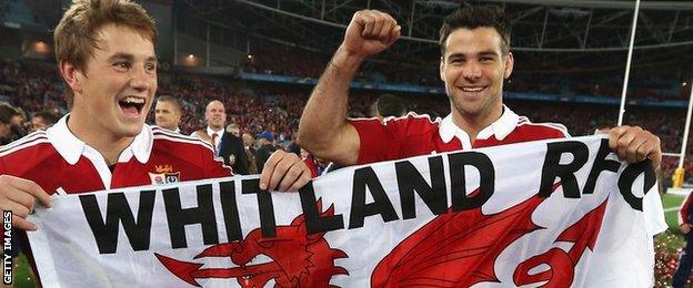 Jonathan Davies and Mike Phillips fly Whitland RFC's Welsh flag as they celebrate the 2013 Lions tour win in Australia