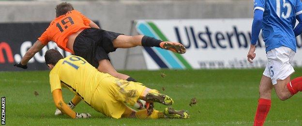 Linfield keeper Ross Glendinning was sent off for fouling Declan O'Brien of Glenavon