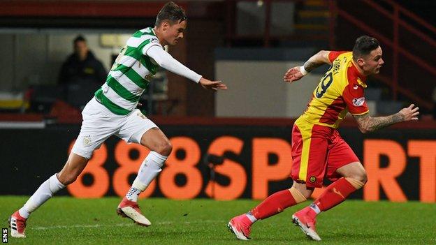 Partick's Miles Storey stumbles in the box after being tugged back by Celtic's Mikael Lustig