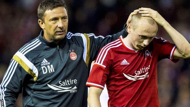 Derek McInnes consoles Willo Flood after defeat by Real Sociedad