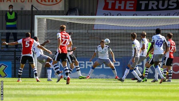 Aaron Martin scores for Exeter against Colchester