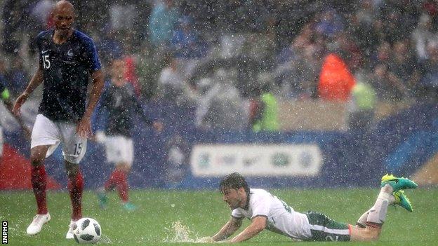 Republic of Ireland substitute Harry Arter slips as he attempts to challenge France midfielder Steven N'Zonzi