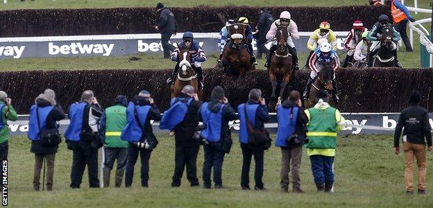 Photographers on the course during a race on the second day of the Festival