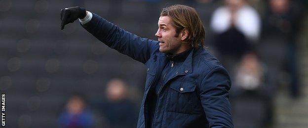 Robbie Neilson oversees an MK Dons fixture