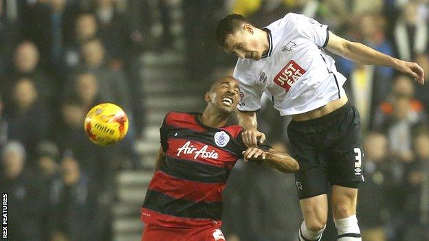 Craig Forsyth (right) challenges QPR's Karl Henry