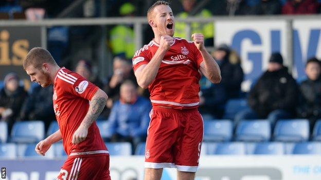 Adam Rooney celebrates scoring for Aberdeen
