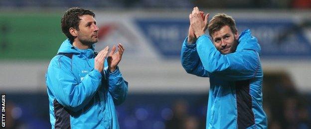 Danny Cowley (left) and Nicky Cowley applaud Lincoln's fans