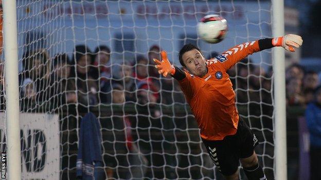 Limerick keeper Brendan Clarke fails to stop Barry McNamee's free-kick hitting the net