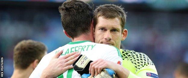 Michael McGovern embraces Kyle Lafferty at the Euro 2016 finals