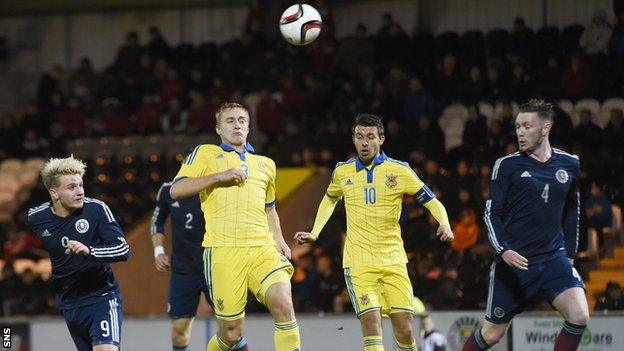 Jason Cummings heads a goal for Scotland Under-21s against Ukraine