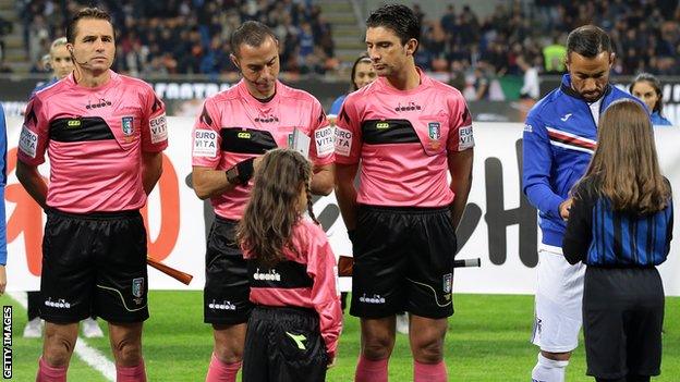 Italian football players handing out copies of Anne Frank's diary.