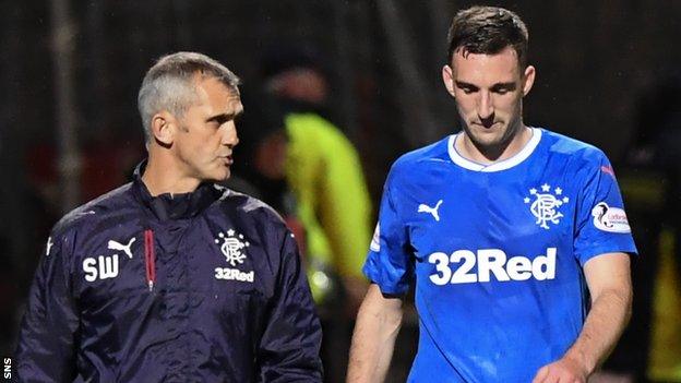 Rangers' Lee Wallace (right) goes off injured against Partick Thistle