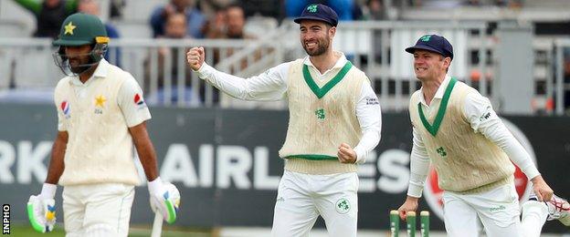 Andrew Balbirnie and William Porterfield celebrate the dismissal of Asad Shafiq