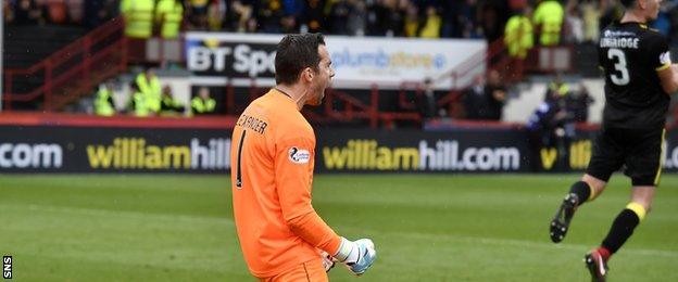 Neil Alexander celebrates