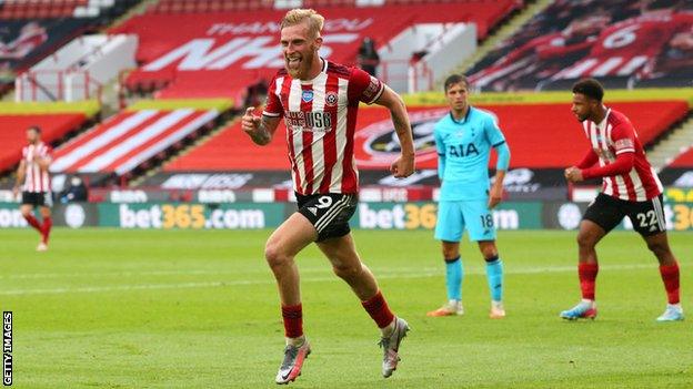 Oli McBurnie celebrates scoring against Tottenham