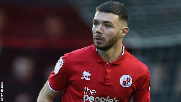 Joe Maguire in action for Crawley Town