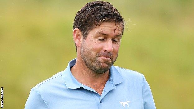 Robert Rock looks almost bemused after knocking in a birdie putt at the 16th at Lahinch