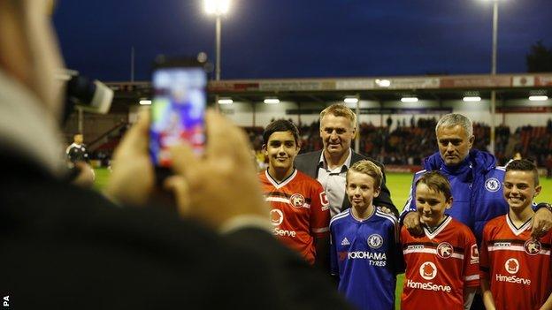 Chelsea boss Jose Mouninho lines up with opposite number Dean Smith before Tuesday's 4-1 win at Walsall