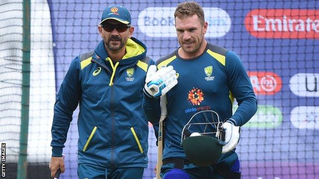 Australia coach Justin Langer (left) and captain Aaron Finch (right) talk during a nets session