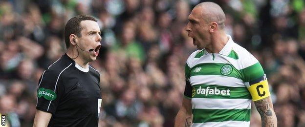 Referee assistant Douglas Ross and Celtic's Scott Brown