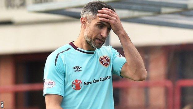 Hearts' Aaron Hughes goes off injured against Dundee