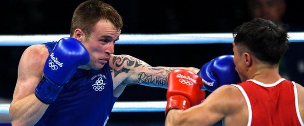 Steven Donnelly lands a punch during his Olympic Games victory over Tuvshinbat Byamba