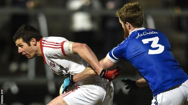 Sean Cavanagh is challenged by Cavan's Rory Dunne in last year's Dr McKenna Cup final