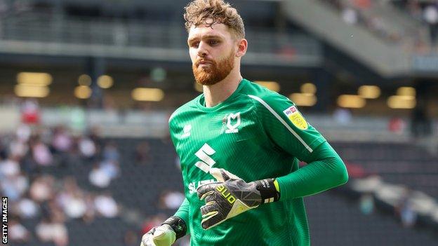 Andrew Fisher signed a long-term deal at MK Dons in January 2021