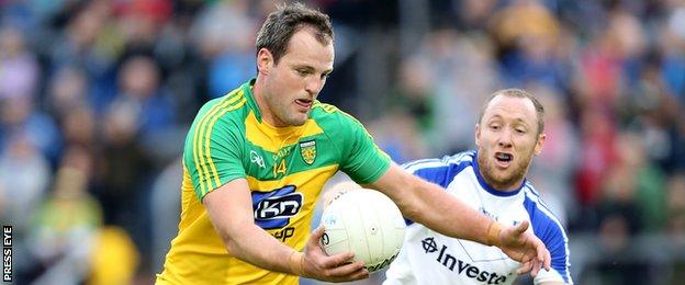 Michael Murphy attempts to get in a shot despite the attentions of Monaghan's Vinny Corey