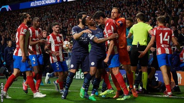 Manchester City and Atletico Madrid players (including Raheem Sterling and Stefan Savic - centre) clash