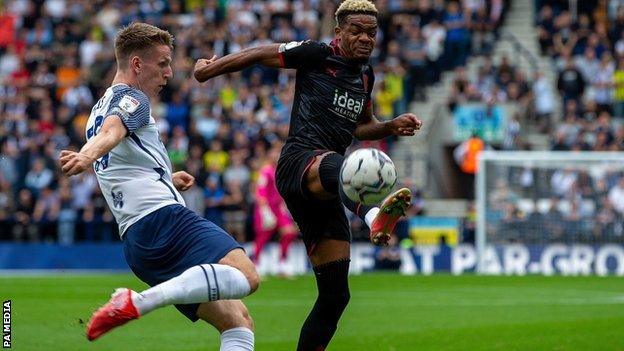 Preston's Emil Riis and West Brom's Grady Diangana