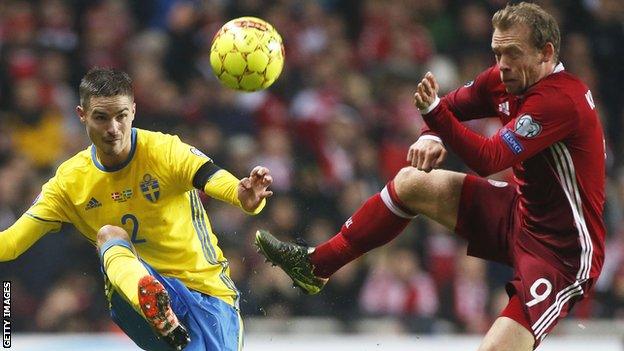 Celtic's Mikael Lustig (left) in action for Sweden against Denmark