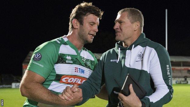 Benetton's Fuser Marco celebrates with director of rugby Marius Goosen