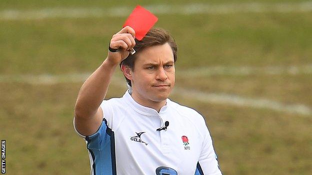 Jack Makepeace shows a red card