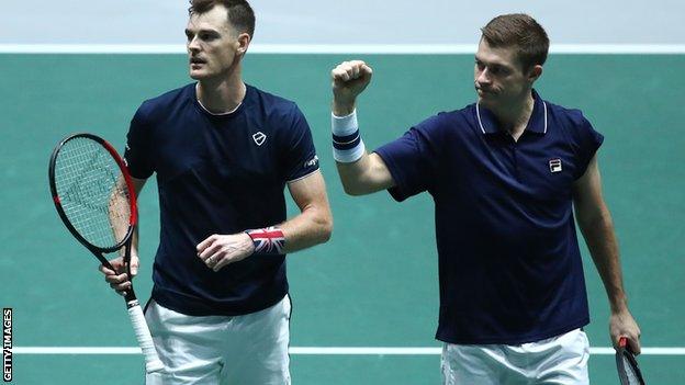 Jamie Murray and Neal Skupski celebrate reaching the Davis Cup quarter-finals