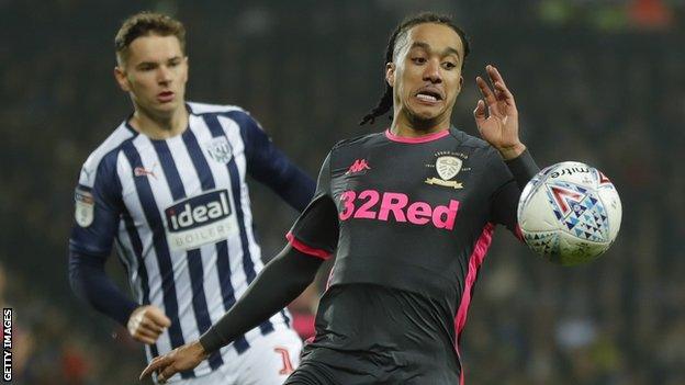 West Bromwich Albion and Leeds United players compete for a bouncing ball