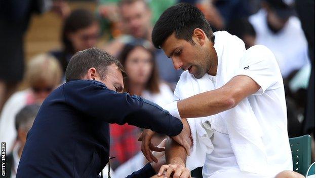 Novak Djokovic has treatment on his elbow