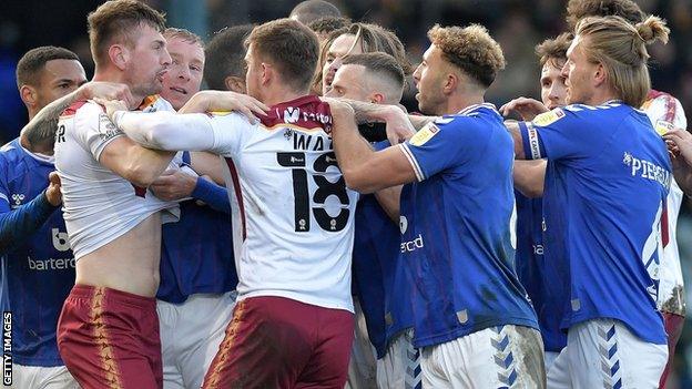 Bradford and Oldham players scuffle