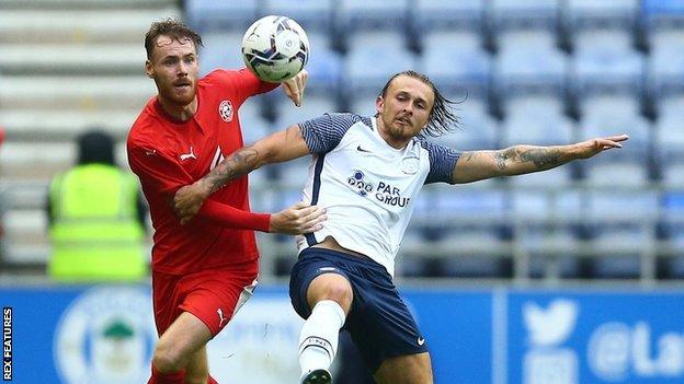 Jamie Thomas (right) featured in North End's pre-season friendly with Wigan Athletic