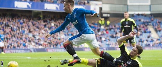 Barrie McKay is brought down by Stranraer's Ross Barbour