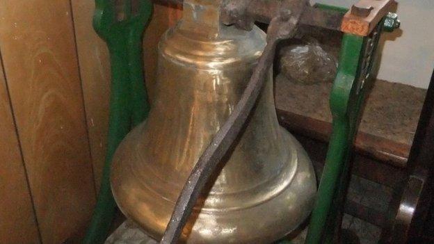 A large bell, from the original church