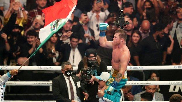 Saul Canelo Alvarez is held aloft