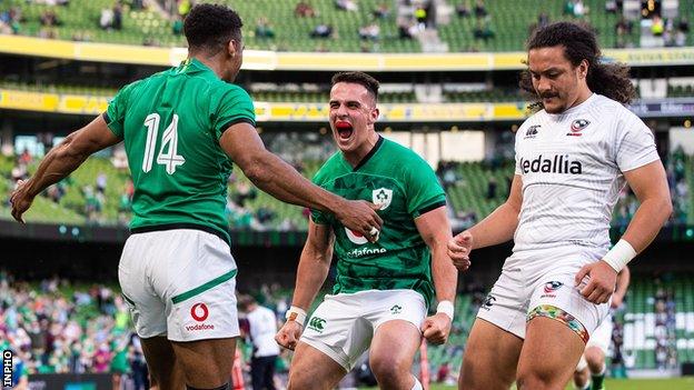 James Hume and Robert Baloucoune celebrate Baloucoune's try during their international debuts