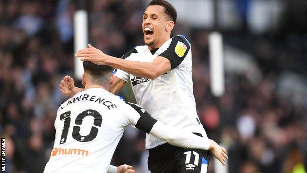 Ravel Morrison and Tom Lawrence embrace