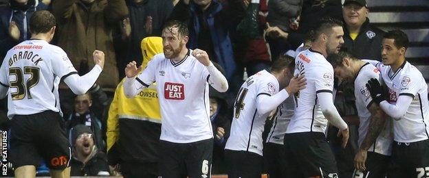 Derby players celebrate their first-half equaliser against Brighton