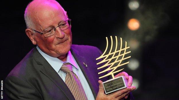 Brother Colm O'Connell with a World Athletics award