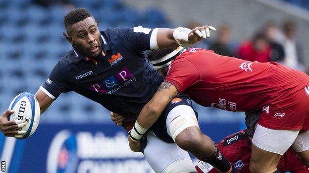 Edinburgh number eight Viliame Mata offloads against Toulon