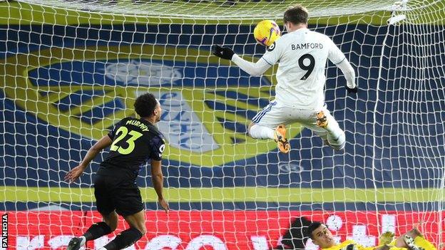 Patrick Bamford (right) scores for Leeds